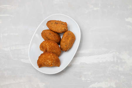 typical portuguese appetizer on small white dish on ceramicの写真素材