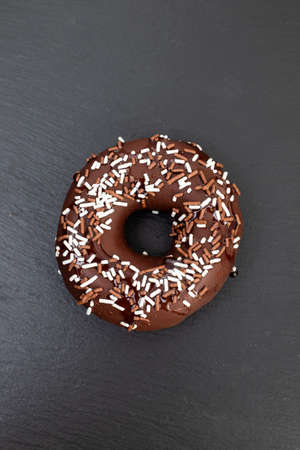 chocolate doughnut on small dish on ceramicの写真素材