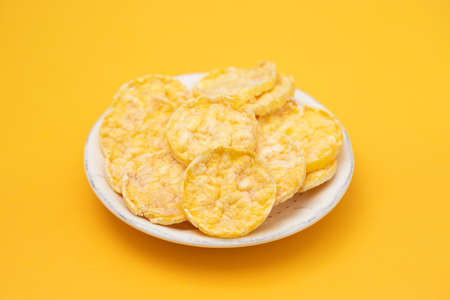 small mini crispy corn diet toasts on white dish