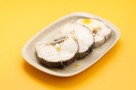 boiled fresh fish with olive oil in dishの写真素材