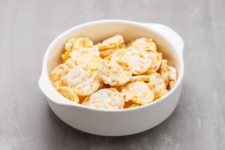 gluten free corn cake with cheese for healthy breakfast in white bowl