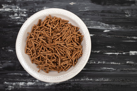 Wheat Bran Breakfast Cereal in white bowlの写真素材