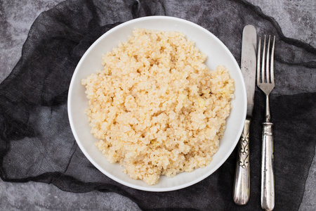Tasty fresh boiled quinoa in white bowlの写真素材