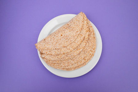 Whole grain tortilla wraps on white plate