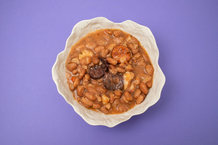 typical portuguese dish with beans and smoked sausagesの写真素材