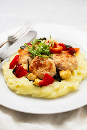 Fried meatballs of turkey and mashed potato on plateの写真素材