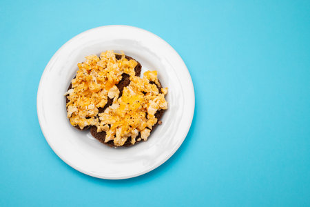 scramble eggs with black bread on dish
