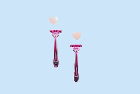 women's pink razor on blue backgroundの写真素材