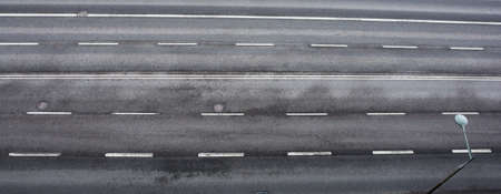 road with asphalt pavement and markings, top viewの写真素材