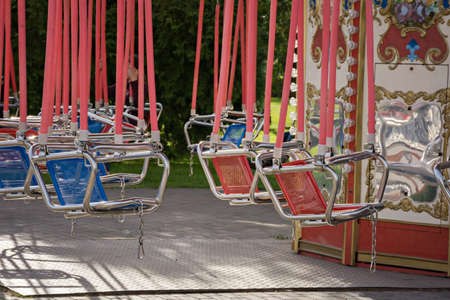 Multicolored carousels in the city park.の写真素材