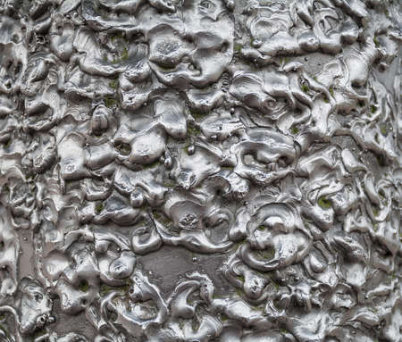 The tuberous texture of white metal. Abstract background.