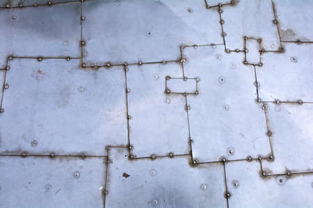 texture. sheets of white metal with rivets. metal background. space for text.の写真素材