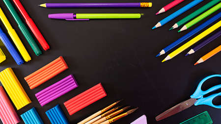 School flatley on the topic back to school, school supplies on chalk board with copy spaceの写真素材