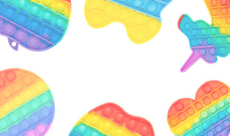 Multicolored pastel rainbow touch toys pop it on white background with copy spaceの写真素材