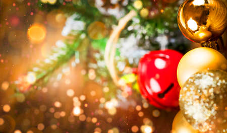 Christmas background with copy space, golden Christmas decorations and holiday and magic atmosphere, suitable for postcards and gift bagsの写真素材