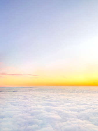 Clouds and sky background, birds eye view at sunset, dawn, beautiful atmospheric pastel backgroundの写真素材