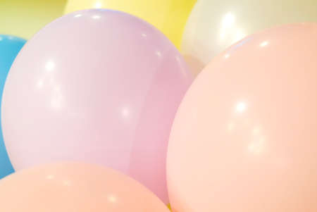 Balloons in pastel colors close up in shades of pinkの写真素材