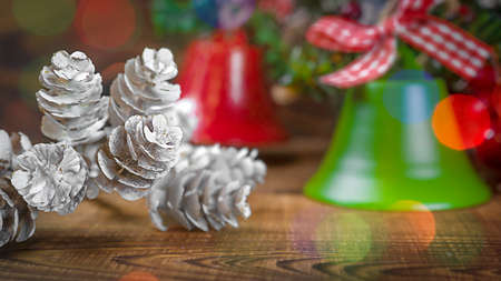 Christmas bells on white wooden background with copy spaceの写真素材