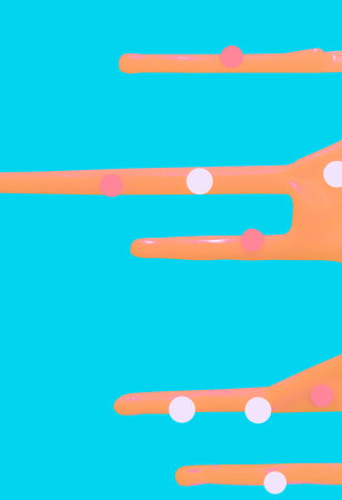 bright orange contrasting smudges of icing on a cake on a blue backgroundの写真素材