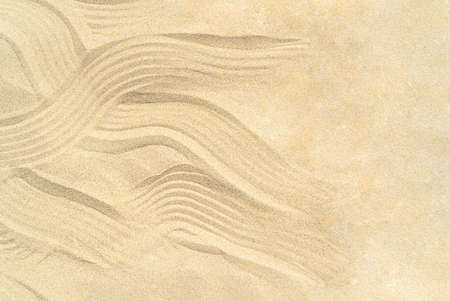 Drawing of waves on the sand on the beach, sand patternの写真素材