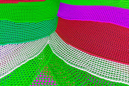 Abstract multicolored saturated bright art background from knitted threads. High quality photoの写真素材