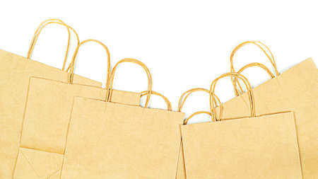 Lot of paper eco-friendly kraft bags on white background top viewの写真素材