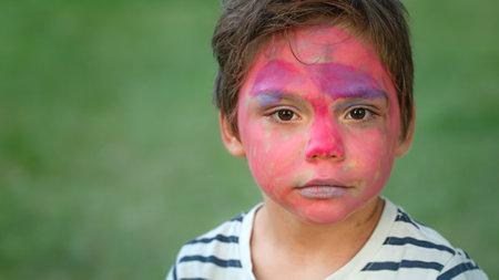 Close-up portrait of a boy with a painted faceの写真素材