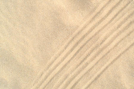 Texture of sea sand background closeup with ornamentの写真素材