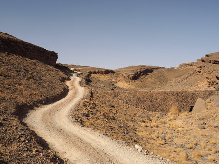 Desert route in lifeless landscape, Sahara, Morocco, North Africa.の写真素材