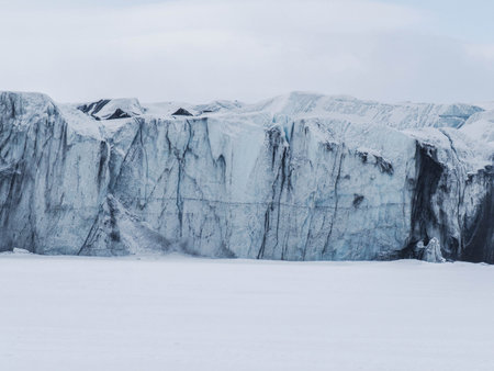 Front of the glacier, cracked blue, white and black ice. Spitsbergen, Norway
