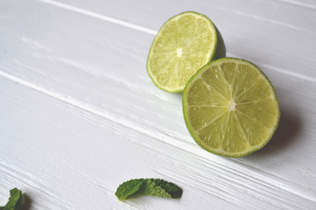 Lime on the white wooden background.の写真素材