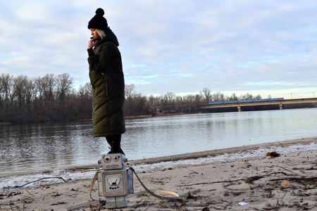 Woman relaxing near the river.の写真素材
