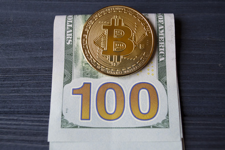 Golden bitcoin and money. Gold coin of cryptocurrencyの写真素材