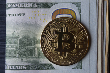 Golden bitcoin and money. Gold coin of cryptocurrency.の写真素材