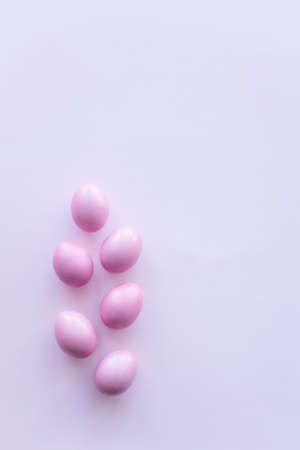 pink easter eggs on pink background with place for text. Minimal