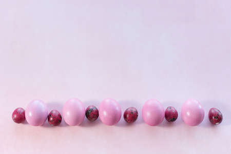 pink easter eggs on pink background with place for text. Minimalの写真素材