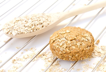 oatmeal in the wooden spoon and raw doughの写真素材