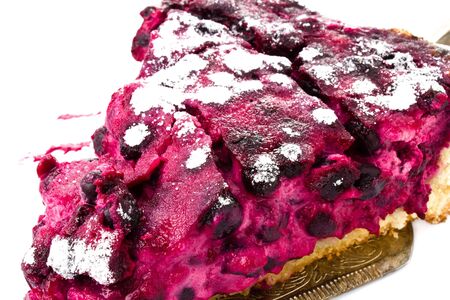 A piece of blueberry pie on white backgroundの写真素材
