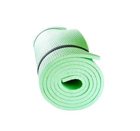 Lightweight foam Yoga Mat roll isolated on white の写真素材