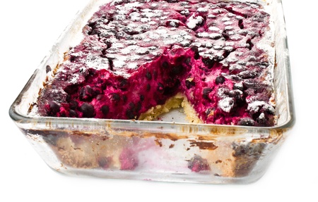 Side up and close view of fresh blueberry  pie cut in half to show filling on white backgroundの写真素材