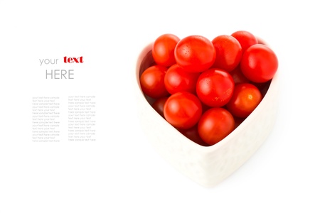 fresh tomatos in a heart shape representing love and valentines day images with a simple textの写真素材