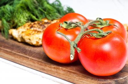 Grilled chicken breasts fillet with fresh vegetablesの写真素材