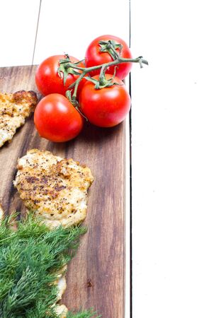 Grilled chicken breasts fillet with fresh vegetablesの写真素材