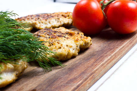 Grilled chicken breasts fillet with fresh vegetables closeupの写真素材