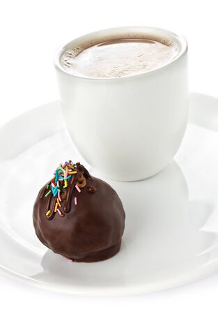 Gourmet dark tasty chocolate bonbons and cup of coffee on white backgroundの写真素材