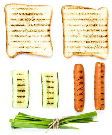 Breakfast set of toast bread, tomato, sausage and herbs, isolated on white, macroの写真素材
