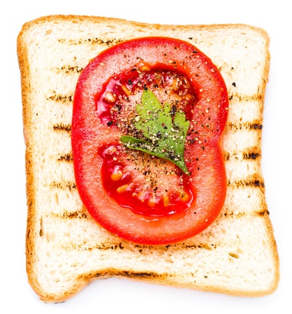 White bread toast with tomato. Isolated on white background, macroの写真素材