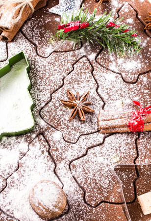 Christmas Gingerbread baking background powdered, cookie cutters, spices and nuts. Christmas festive food, top view, closeup.の写真素材