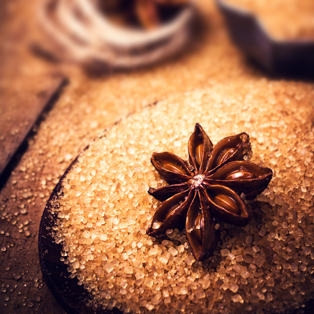 Baking ingredients Cinnamon sticks,  star anise and cane brown sugar. Winter Christmas spices macro.の写真素材
