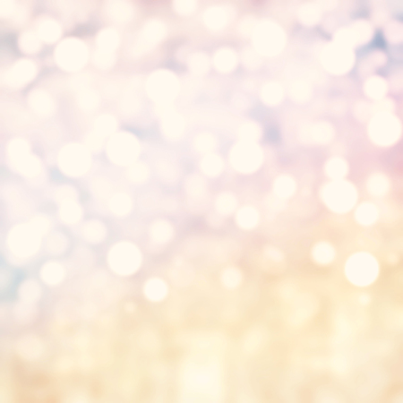 Gold Festive Christmas background. Abstract twinkled  bright background with bokeh defocused golden lights 
の写真素材